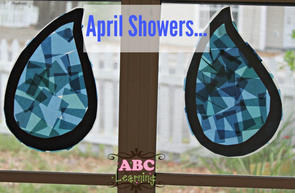 April showers craft for toddlers which is a raindrop that is blue that was made to look like a suncatcher.