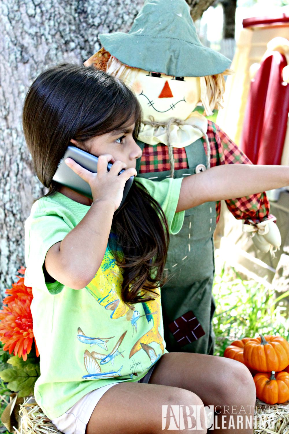 7 Tips When Visiting a Pumpkin Patch or Fall Festival with the Family with phone
