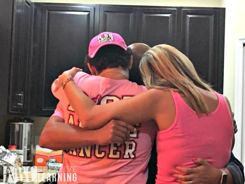 My family had a surprise breast cancer party for me before starting chemo. I'm in the middle surrounded by all of my siblings!